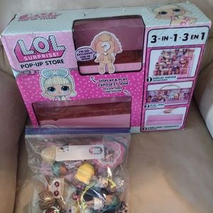 LOL organizer carrying case with several dolls and accessories